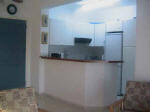 The Open plan kitchen is equipped with fridge/freezer, oven/hob, microwave, washing machine, toaster and ironing board.