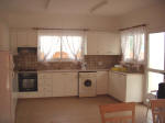 The kitchen is equipped with a fridge, electric oven, washing machine, microwave and iron. 