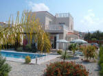 Near to the village of Peyia (Pegia) near Paphos (Pafos) in Cyprus, this villa offers all modern conveniences , three en - suite bedrooms, each with separate sunbathing terraces, a well - maintained pool with sun lounges and parasols, and colourful landscaped gardens.